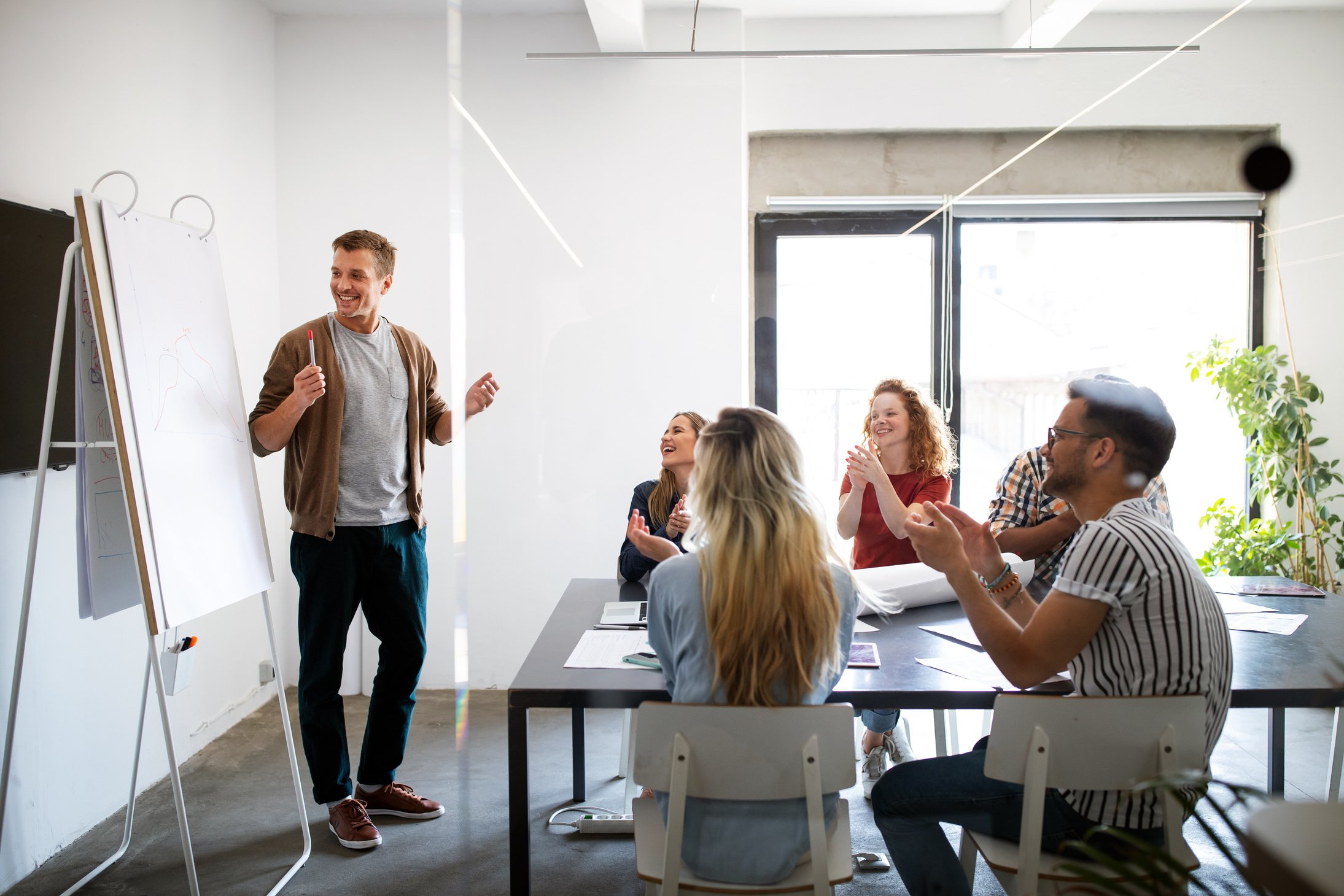 Successful company with happy employees in modern office